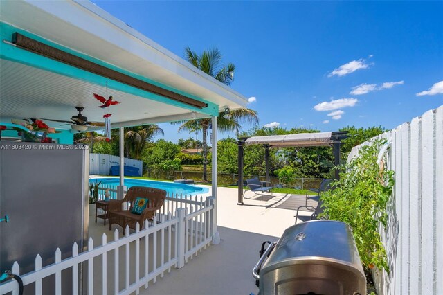12351 NW 29th Mnr, Sunrise, FL 33323 - fenced backyard featuring a ceiling fan, a patio area, and a pergola