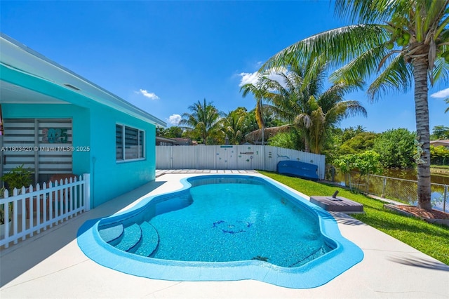 12351 NW 29th Mnr, Sunrise, FL 33323 - view of swimming pool with a fenced backyard