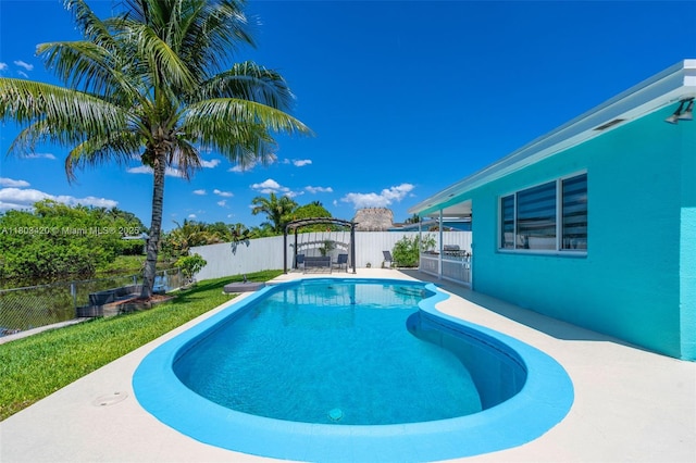 12351 NW 29th Mnr, Sunrise, FL 33323 - view of swimming pool with a fenced backyard and a patio