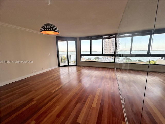 520 Brickell Key Dr Unit A811, Miami, FL 33131 - empty room with wood finished floors and baseboards