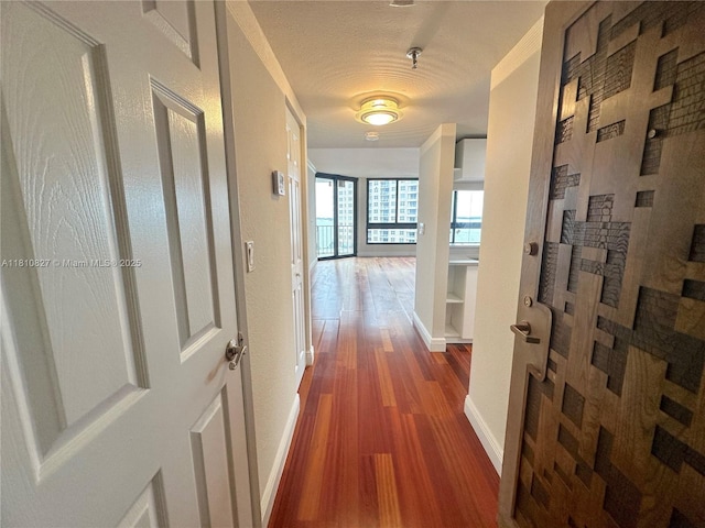 520 Brickell Key Dr Unit A811, Miami, FL 33131 - corridor featuring wood finished floors and baseboards