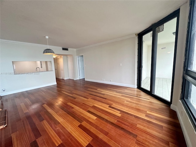 520 Brickell Key Dr Unit A811, Miami, FL 33131 - unfurnished living room with wood finished floors, crown molding, and baseboards
