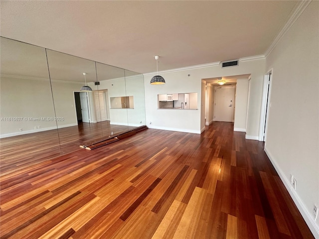 520 Brickell Key Dr Unit A811, Miami, FL 33131 - unfurnished living room featuring wood finished floors, crown molding, and baseboards