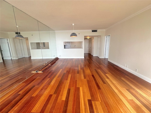 520 Brickell Key Dr Unit A811, Miami, FL 33131 - unfurnished living room with wood finished floors, crown molding, and baseboards