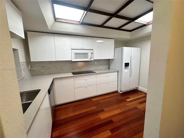 520 Brickell Key Dr Unit A811, Miami, FL 33131 - kitchen featuring white appliances, white cabinets, decorative backsplash, and dark wood finished floors