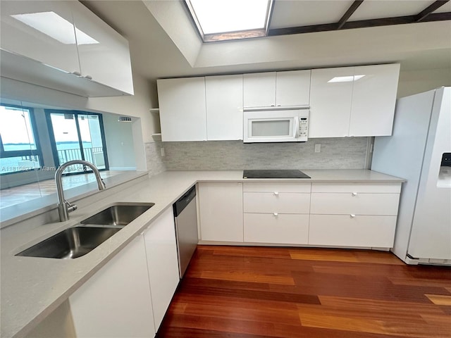 520 Brickell Key Dr Unit A811, Miami, FL 33131 - kitchen featuring white appliances, a sink, white cabinets, and light countertops