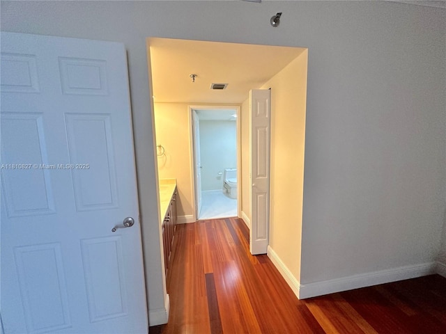 520 Brickell Key Dr Unit A811, Miami, FL 33131 - hallway featuring dark wood-style floors and baseboards