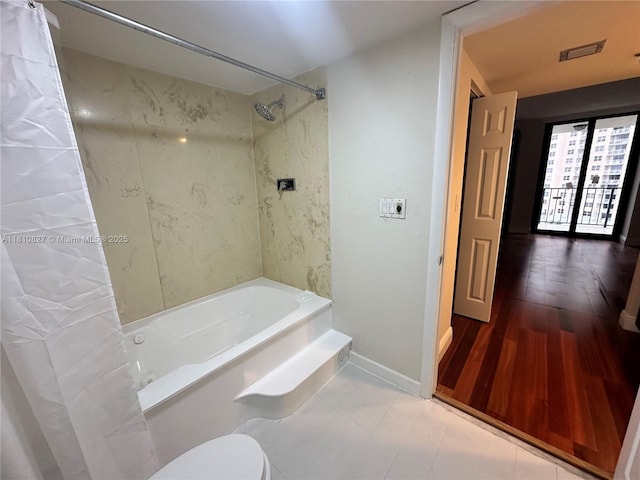 520 Brickell Key Dr Unit A811, Miami, FL 33131 - bathroom with shower / bathtub combination with curtain, toilet, and baseboards