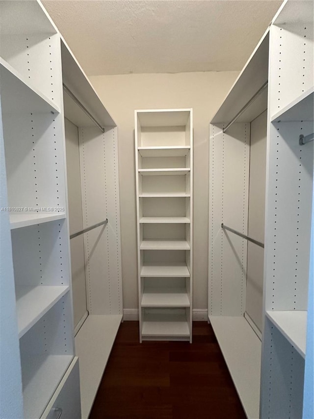 520 Brickell Key Dr Unit A811, Miami, FL 33131 - walk in closet with dark wood-style flooring