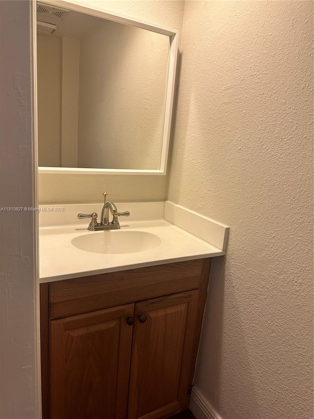 520 Brickell Key Dr Unit A811, Miami, FL 33131 - bathroom featuring vanity and a textured wall