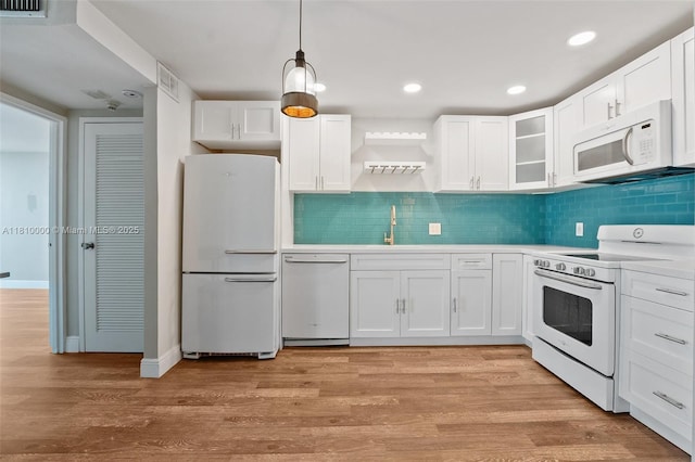 150 SE 25th Rd Unit 10K, Miami, FL 33129 - kitchen with white appliances, a sink, white cabinets, light wood-style floors, and recessed lighting