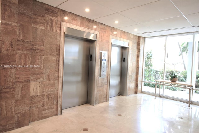 150 SE 25th Rd Unit 10K, Miami, FL 33129 - spare room featuring elevator, plenty of natural light, and a wall of windows