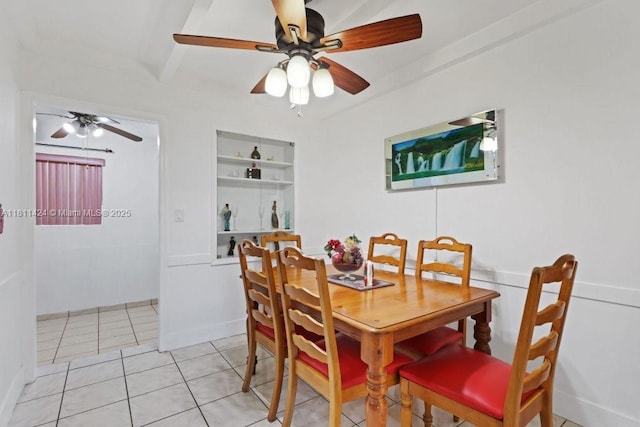 1090 SW 31st St, Fort Lauderdale, FL 33315 - dining area featuring built in shelves, a ceiling fan, light tile patterned floors, and beamed ceiling