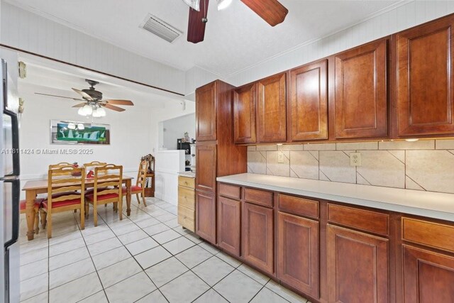 1090 SW 31st St, Fort Lauderdale, FL 33315 - kitchen featuring ceiling fan, light countertops, backsplash, and light tile patterned floors