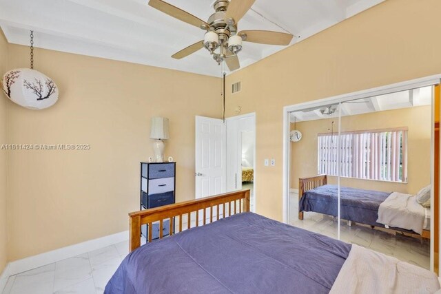 1090 SW 31st St, Fort Lauderdale, FL 33315 - bedroom with light marble finish floors, baseboards, and ceiling fan
