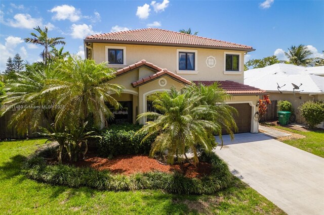 21241 SW 88th Pl, Cutler Bay, FL 33189 - mediterranean / spanish-style home featuring a tile roof, concrete driveway, and stucco siding