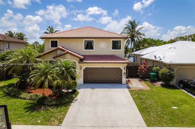 21241 SW 88th Pl, Cutler Bay, FL 33189 - mediterranean / spanish house featuring a tile roof, stucco siding, driveway, and a garage