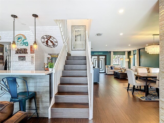 21241 SW 88th Pl, Cutler Bay, FL 33189 - staircase featuring wood finished floors, recessed lighting, and a chandelier