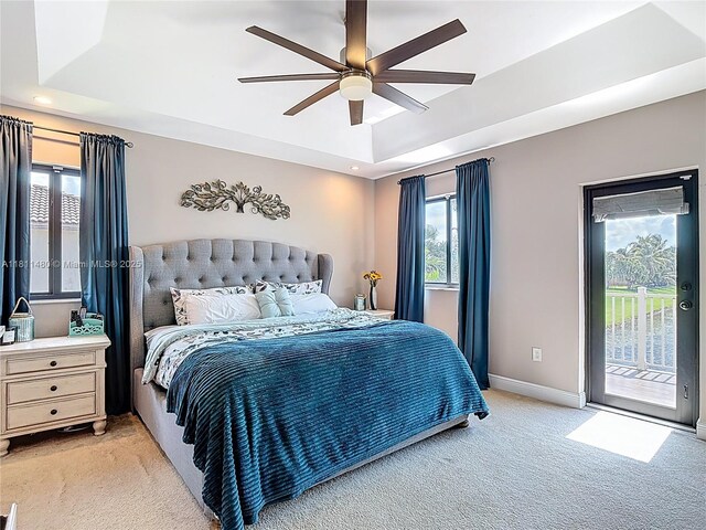 21241 SW 88th Pl, Cutler Bay, FL 33189 - bedroom with light carpet, a raised ceiling, access to outside, baseboards, and a ceiling fan