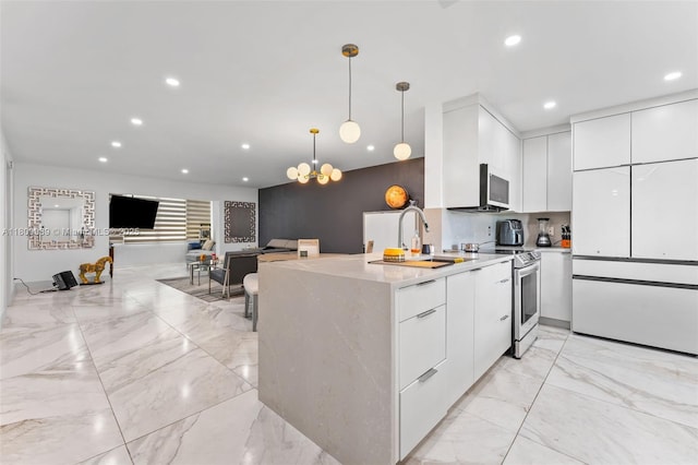 4140 NW 44th Ave Unit 114, Lauderdale Lakes, FL 33319 - kitchen with modern cabinets, electric stove, light marble finish flooring, white cabinets, and recessed lighting