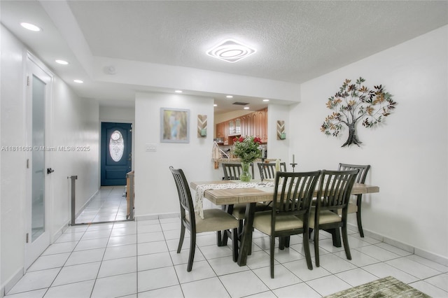834 W 80th Pl, Hialeah, FL 33014 - dining room featuring light tile patterned floors, a textured ceiling, baseboards, and recessed lighting