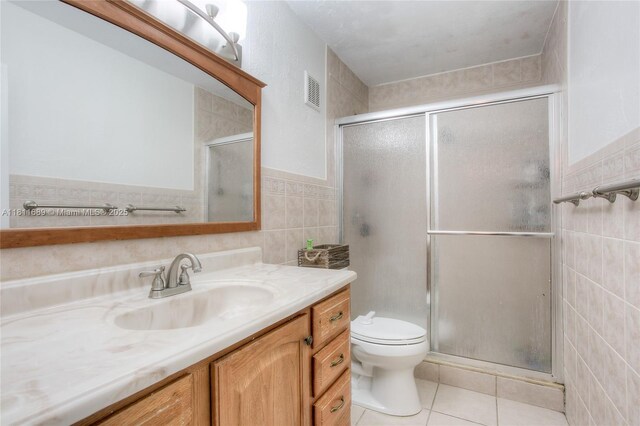 834 W 80th Pl, Hialeah, FL 33014 - full bath with tile walls, vanity, a stall shower, tile patterned floors, and toilet
