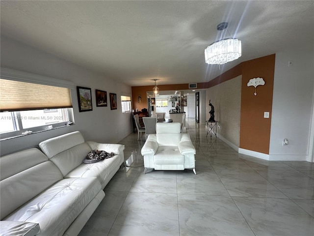 13700 SW 14th St Unit 412D, Pembroke Pines, FL 33027 - living area with a chandelier