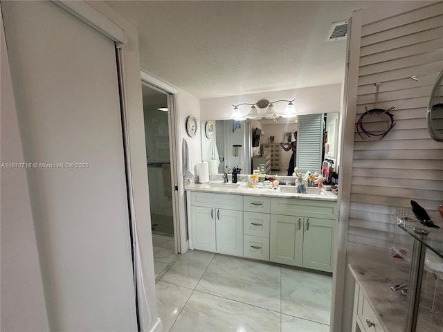 13700 SW 14th St Unit 412D, Pembroke Pines, FL 33027 - bathroom featuring marble finish flooring, double vanity, and a shower stall