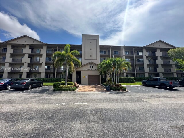 13700 SW 14th St Unit 412D, Pembroke Pines, FL 33027 - view of apartment building / complex featuring uncovered parking