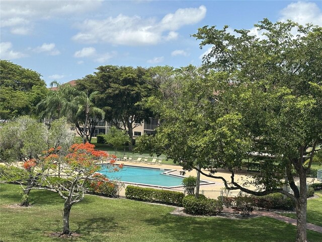13700 SW 14th St Unit 412D, Pembroke Pines, FL 33027 - view of property's community featuring a yard and a swimming pool