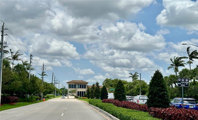13700 SW 14th St Unit 412D, Pembroke Pines, FL 33027 - view of asphalt street with street lights, traffic signs, and curbs