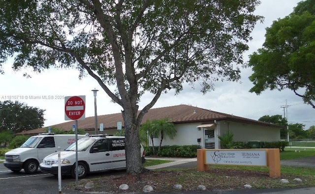 13700 SW 14th St Unit 412D, Pembroke Pines, FL 33027 - view of asphalt street featuring traffic signs