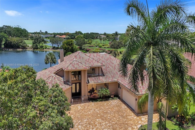 10427 Stonebridge Blvd, Boca Raton, FL 33498 - mediterranean / spanish home with a tile roof, stucco siding, french doors, a garage, and decorative driveway
