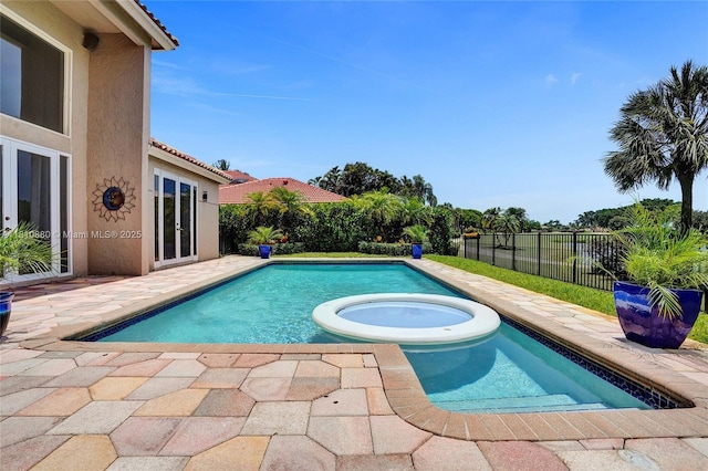 10427 Stonebridge Blvd, Boca Raton, FL 33498 - view of pool with a pool with connected hot tub, a patio area, and french doors