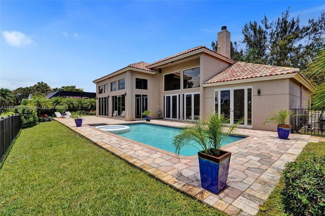 10427 Stonebridge Blvd, Boca Raton, FL 33498 - rear view of house with french doors, stucco siding, a chimney, a patio area, and a tile roof
