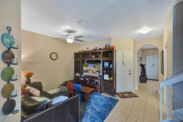 3721 NE 4th Unit 4Th, Homestead, FL 33033 - living area with arched walkways, a ceiling fan, tile patterned flooring, and baseboards