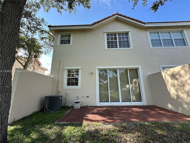12464 SW 42nd St, Miramar, FL 33027 - rear view of property with central AC unit, stucco siding, and a patio