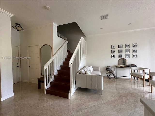 12464 SW 42nd St, Miramar, FL 33027 - stairway featuring a textured ceiling, crown molding, and marble finish floors