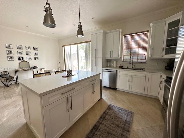 12464 SW 42nd St, Miramar, FL 33027 - kitchen featuring stainless steel appliances, a sink, crown molding, light countertops, and plenty of natural light