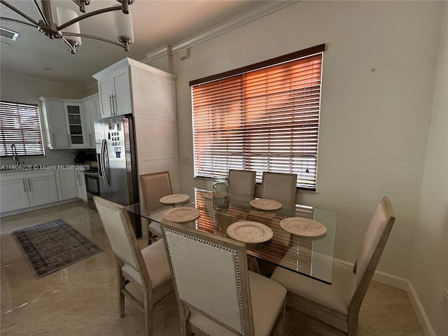 12464 SW 42nd St, Miramar, FL 33027 - dining space with a chandelier, plenty of natural light, and ornamental molding