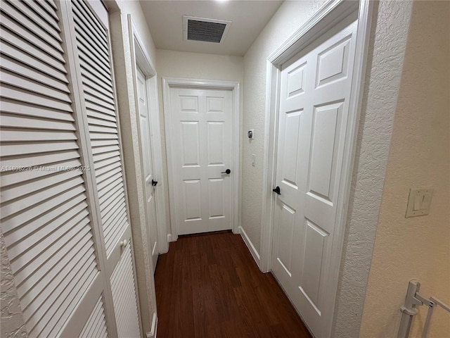 12464 SW 42nd St, Miramar, FL 33027 - hall featuring dark wood finished floors, a textured wall, and baseboards