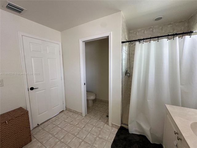 12464 SW 42nd St, Miramar, FL 33027 - bathroom featuring toilet, a shower stall, vanity, and tile patterned floors