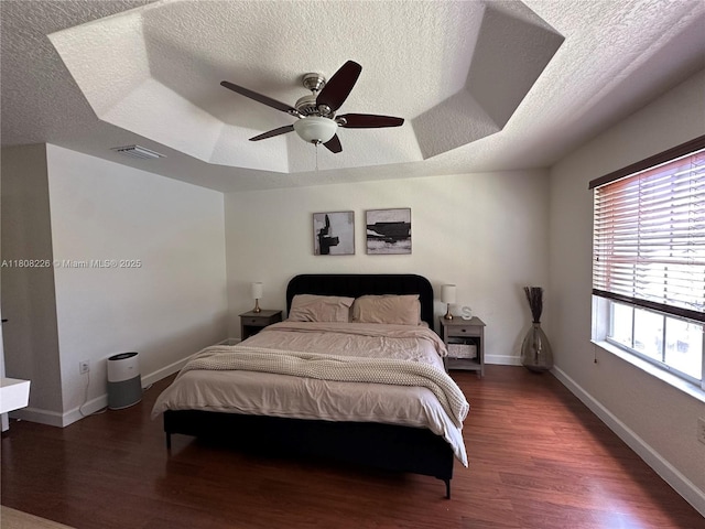 12464 SW 42nd St, Miramar, FL 33027 - bedroom with a textured ceiling, a raised ceiling, wood finished floors, a ceiling fan, and baseboards