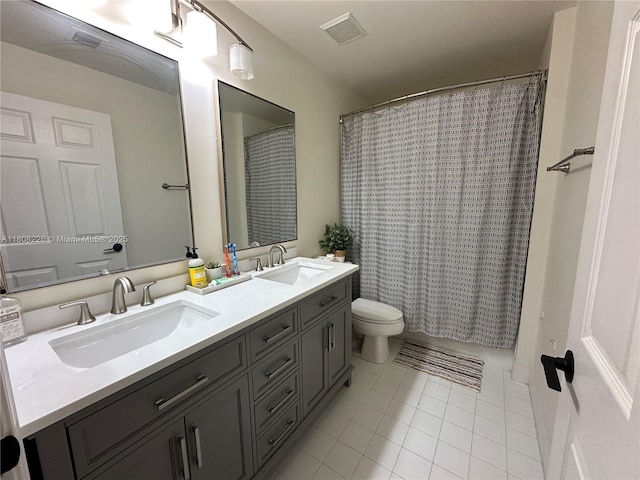 12464 SW 42nd St, Miramar, FL 33027 - full bath featuring tile patterned floors, double vanity, and toilet