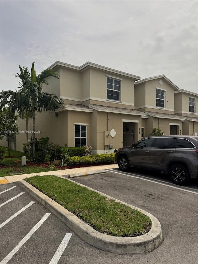 495 NE 5th Way, Florida City, FL 33034 - view of front facade featuring stucco siding and uncovered parking