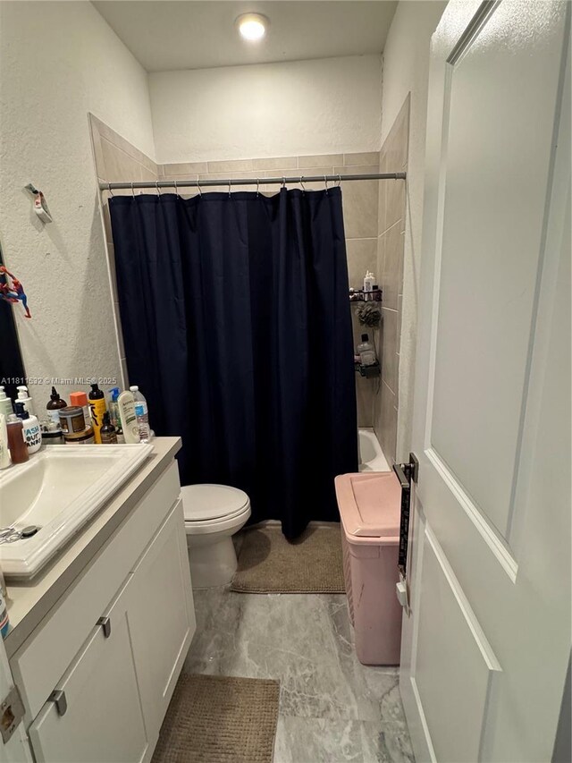 495 NE 5th Way, Florida City, FL 33034 - full bath featuring vanity, toilet, a textured wall, and shower / bathtub combination with curtain