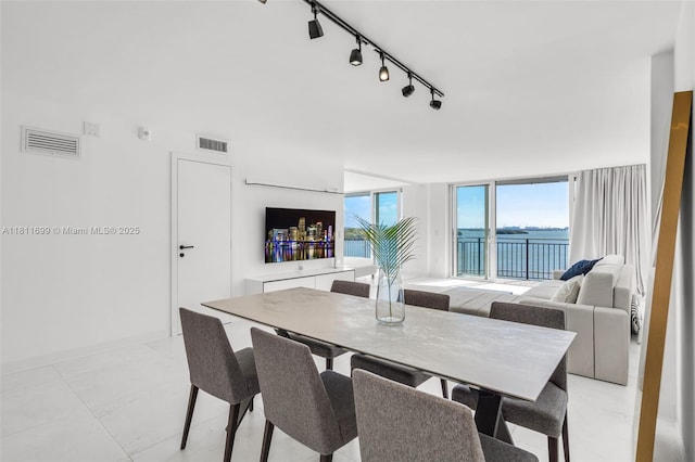 770 NE 69th St Unit 6C, Miami, FL 33138 - dining room with track lighting