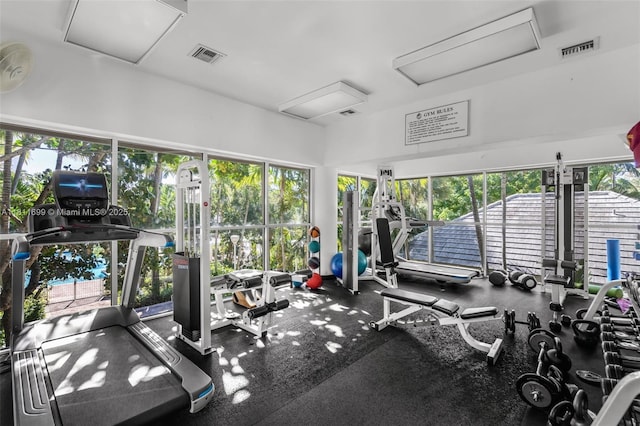 770 NE 69th St Unit 6C, Miami, FL 33138 - exercise room featuring attic access