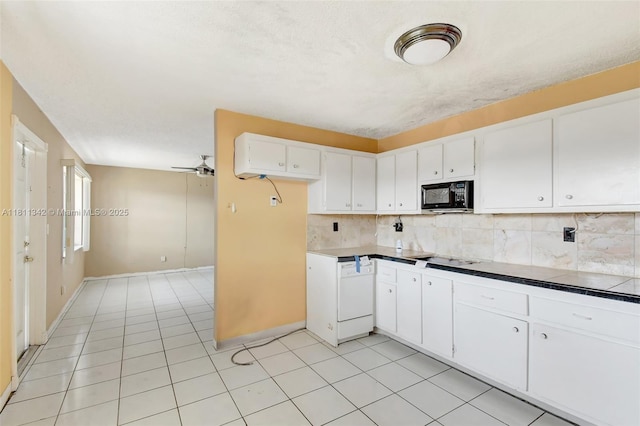 6211 SW 37th St Unit 211, Davie, FL 33314 - kitchen featuring black appliances, backsplash, white cabinetry, and light tile patterned floors