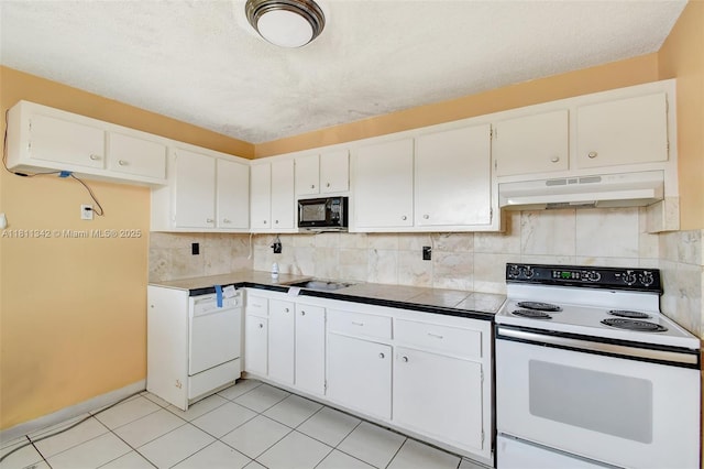 6211 SW 37th St Unit 211, Davie, FL 33314 - kitchen featuring white appliances, extractor fan, white cabinetry, tasteful backsplash, and light tile patterned floors